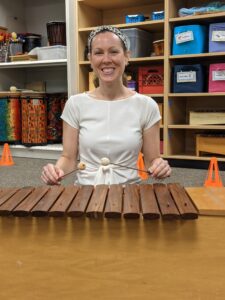 Picture of Ms. Harmon playing the xylophone.